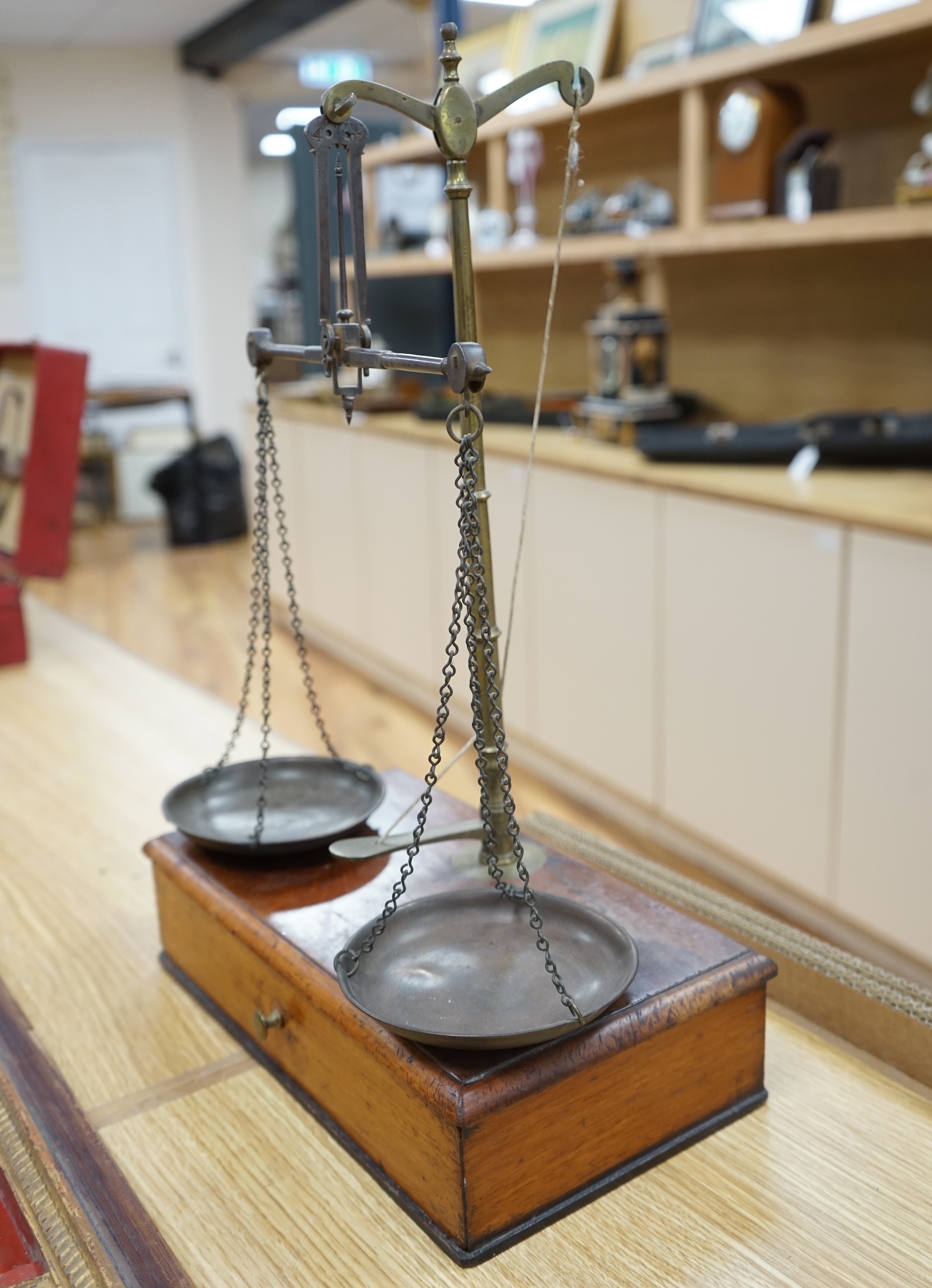 A set of Victorian mahogany and brass beam scales, by Avery, with a repair letter dated 1940 included, 45cm high. Condition - fair